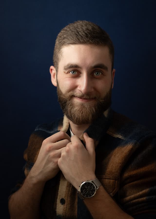 A man posing in a studio